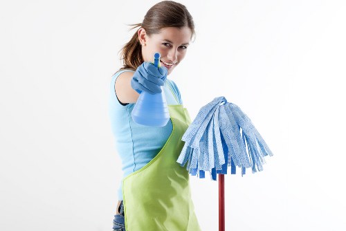Cleaner preparing carpet cleaning equipment safely