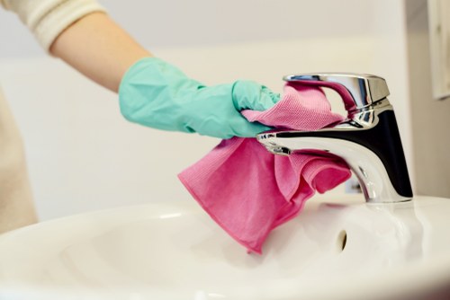 Carpet cleaning technician preparing equipment before a residential cleaning appointment