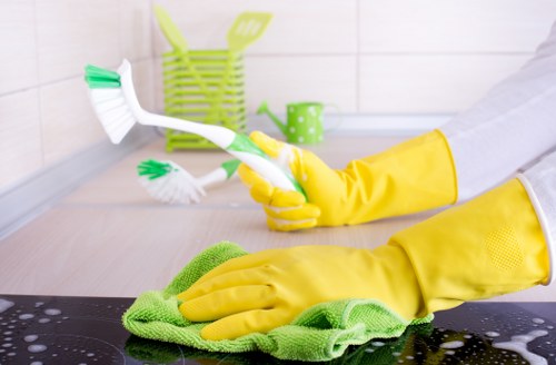 Technician wearing PPE while carrying out carpet cleaning work